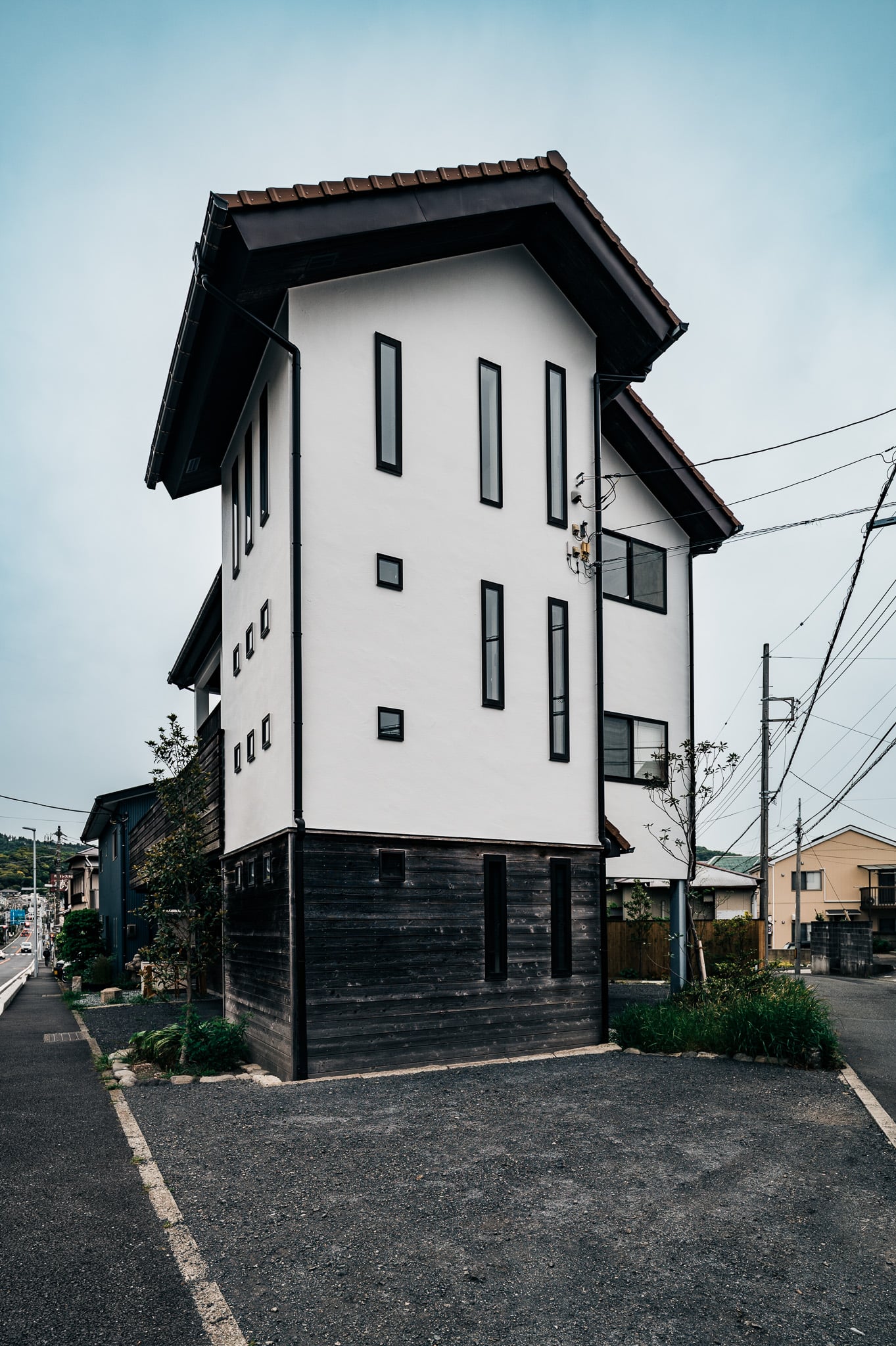TERRA HAYAMA exterior — a storehouse-like facade of white plaster and charred cedar